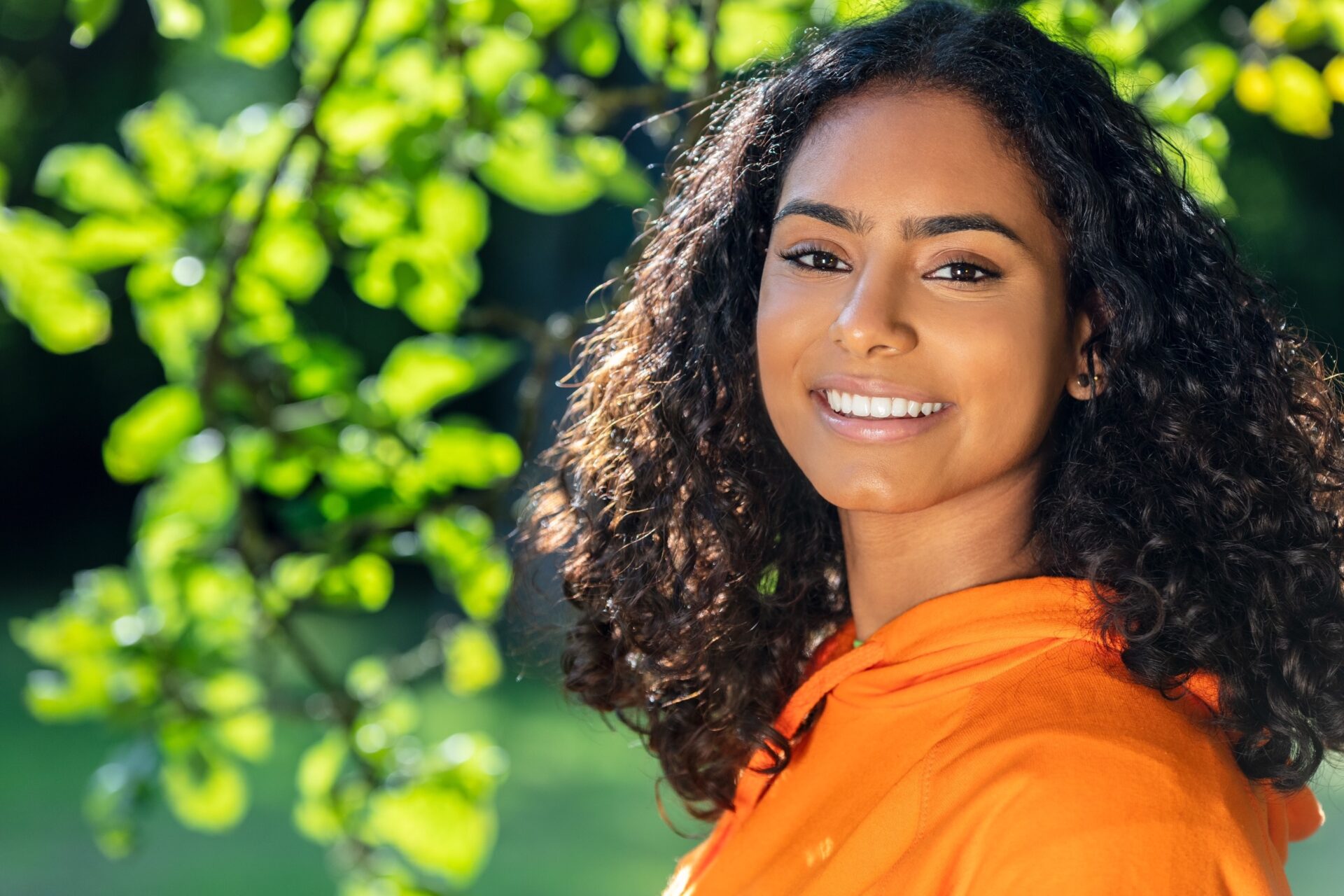 Happy young woman outside